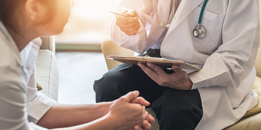 Woman Patient With Doctor Or Psychiatrist Consulting And Diagnos