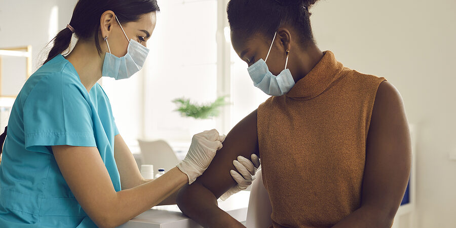 Young African-american Woman Getting Seasonal Influenza Shot Or